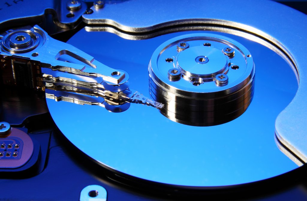 Close-up view of an opened hard drive (toned in blue), best storage for desktop PC