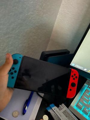 Nintendo Switch (OLED model) w/ Neon Red & Neon Blue Joy-Cons