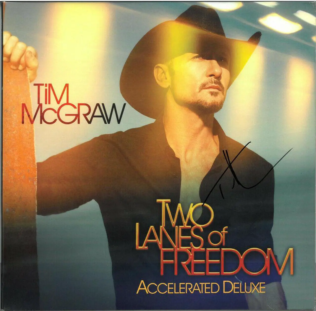 Main image of Tim McGraw signed 2013 Two Lanes of Freedom Album Cover/LP/Vinyl/Record- JSA #JJ96550