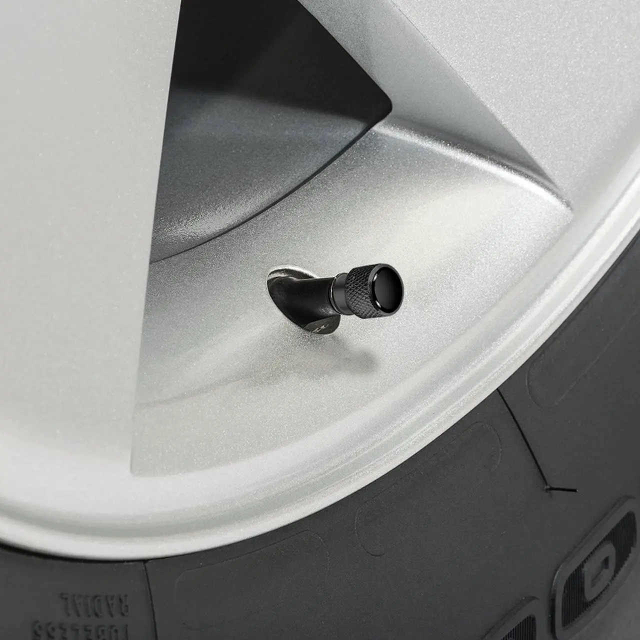 Alt view image 2 of 4 - Nissan NISMO in Black on Black Aluminum Tire Valve Stem Caps