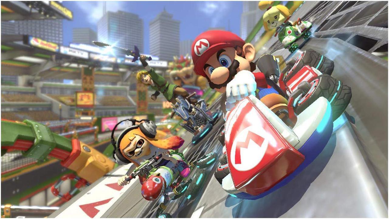 Alt view image 5 of 6 - Nintendo Switch Mario Party Bundle: Super Mario Party, Mario Kart 8 Deluxe and Nintendo Switch 32GB Console with Neon Red and Blue Joy-Con