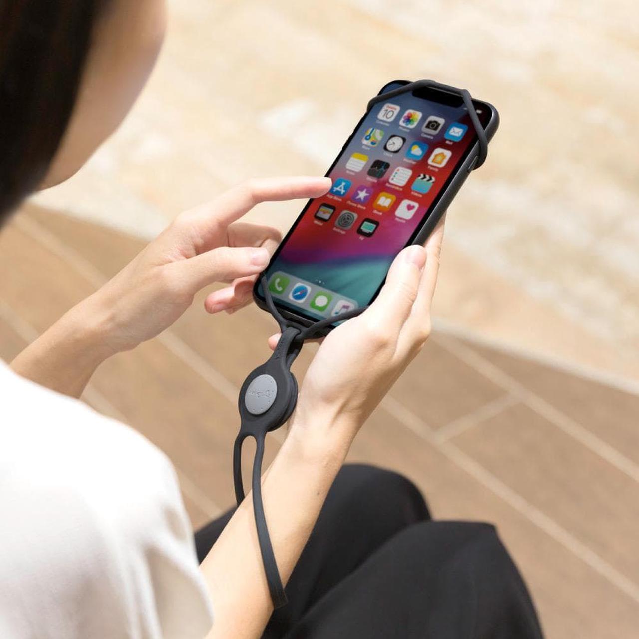 Alt view image 7 of 8 - Bone Strap Phone Tie, Silicone Wrist Lanyard, Universal Cell Phone Wrist Holder, Hand Strap Smartphone Case: iPhone 11 XS XS Max XR X Samsung Galaxy S10 S9 S8 Note 10 9 Pixel 3 XL-Black