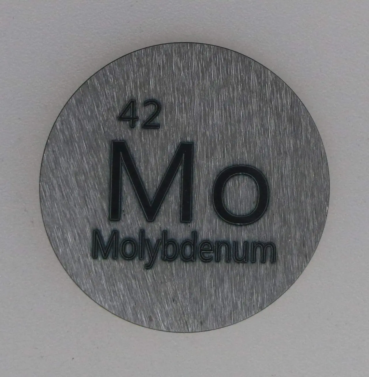 Alt view image 2 of 5 - Molybdenum (Mo) 24.26mm Metal Disc with Acrylic Case for Collection or Experiments