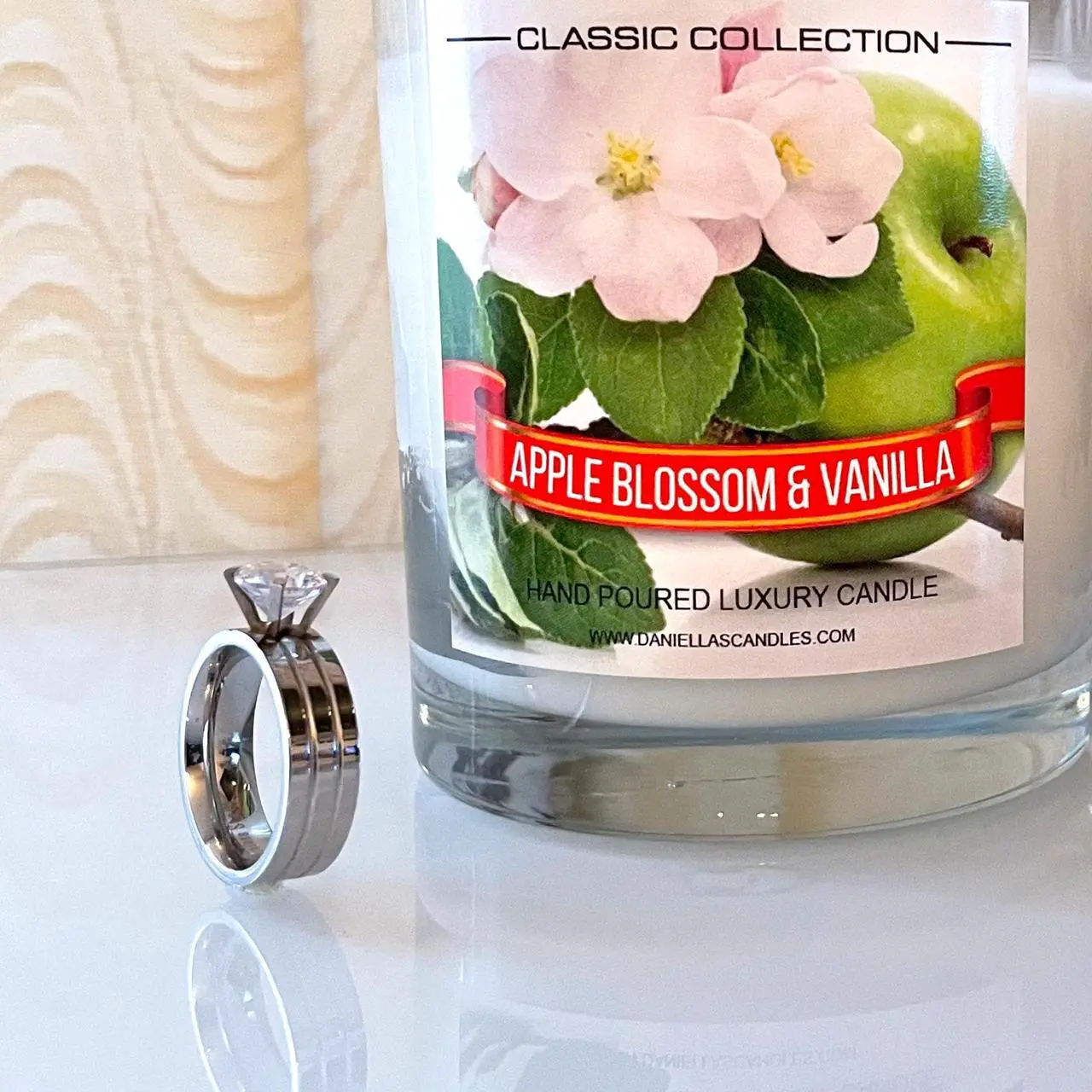 Alt view image 5 of 5 - Daniella's Candles - Apple Blossom and Vanilla Jewelry Candle with Necklace inside