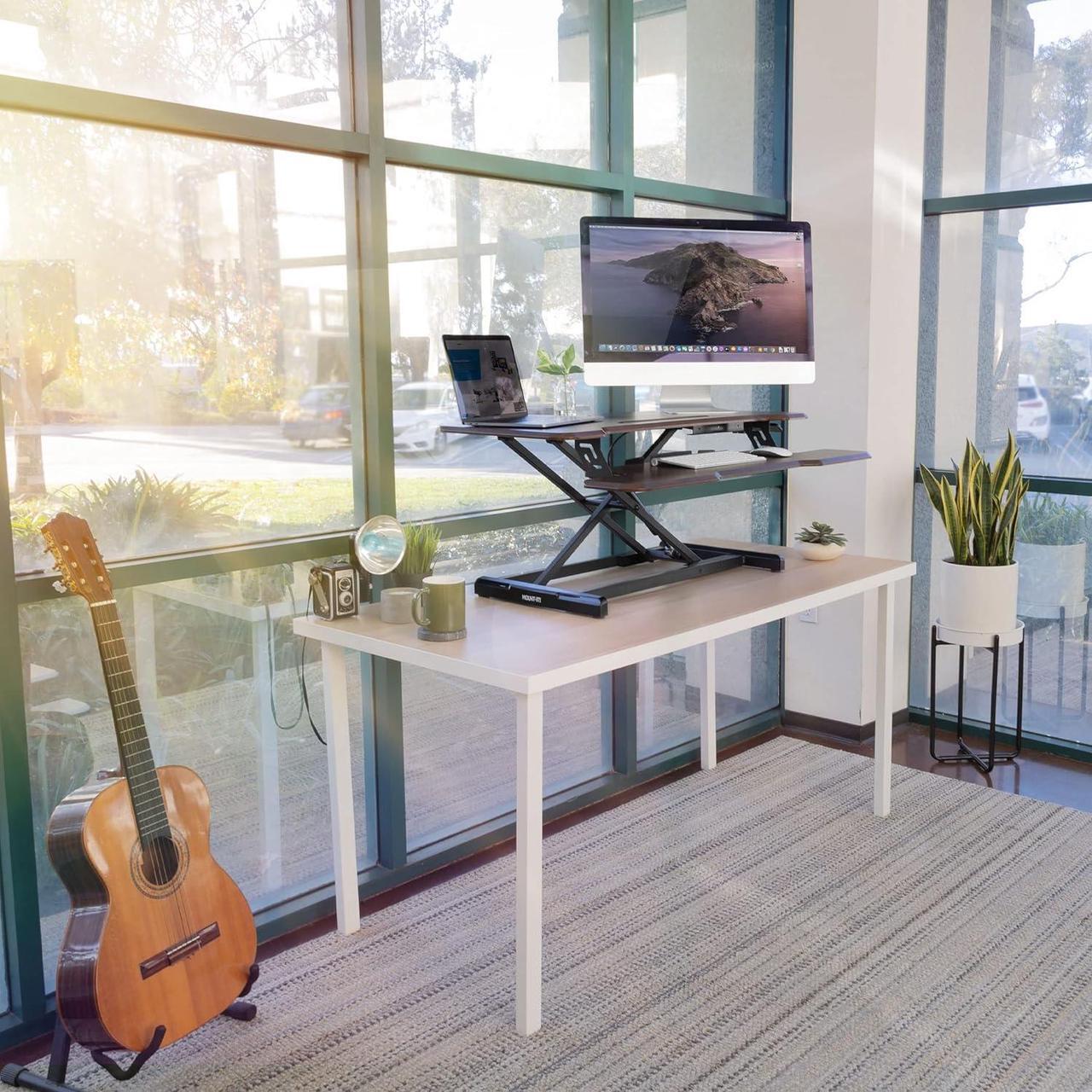 Alt view image 2 of 7 - Mount-It! Height Adjustable Stand Up Desk Converter, 38 Wide Tabletop Standing Desk Riser with Gas Spring Desktop Standing Desk with Keyboard Tray Fits Two Monitors, Dark Walnut