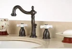 Kingston Brass Wide Spread Lavatory Faucet With Porcelain Lever Handle ORB