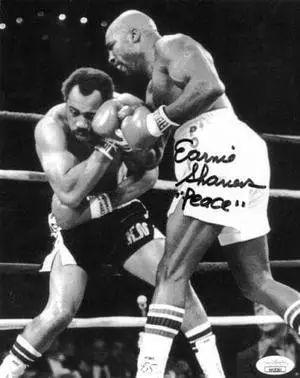 Earnie Shavers signed Boxing B&W 8x10 Photo w/ Peace- JSA Hologram (vs Ken Norton)