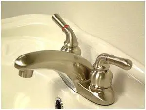 Two Handle 4" Centerset Lavatory Faucet in Satin Nickel by Kingston Brass