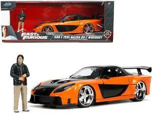 1995 Mazda RX-7 Widebody RHD (Right Hand Drive) Orange Metallic and Black with Han Diecast Figurine "The Fast and the Furious: Tokyo Drift" (2006) Movie 1/24 Diecast Model Car by Jada