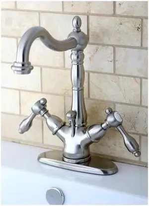 Kingston Brass Tudor 4" Center Lavatory Faucet With Brass Pop-Up in Satin Nickel by Kingston Brass