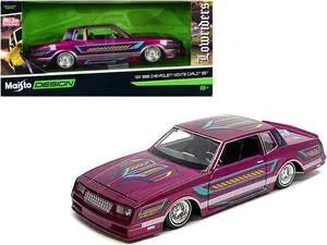 1986 Chevrolet Monte Carlo SS Lowrider Pink Metallic with Graphics "Lowriders" Series 1/24 Diecast Model Car by Maisto