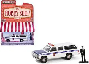 1985 GMC Suburban 2500 "NYC Transit Police Department" White with Blue Stripes and Figure 1/64 Diecast Model Car by Greenlight