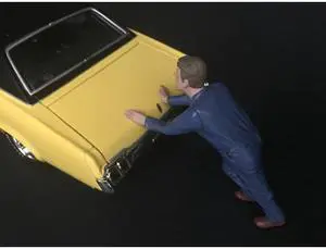 Mechanic Darwin Pushing a Car Figurine for 1/24 Scale Models by American Diorama