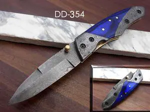 8" long Folding Knife with pocket clip, Hand forged Damascus steel 3.5" blade. Available in Walnut wood, Bull horn, Ram Horn, Red & Blue scale with Damascus Bolster, Cow hide Leather sheath