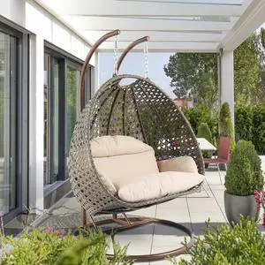 LeisureMod Wicker 2 Person Hanging Egg Swing Chair With Cushion Indoor Outdoor Use in Beige