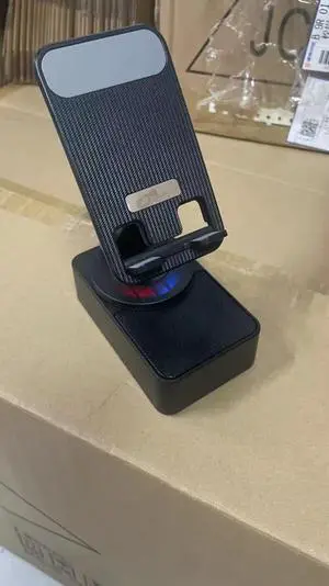 2025 New Three-in-one mobile phone holder Bluetooth speaker charging treasure call speaker multi-function colored light foldable desktop