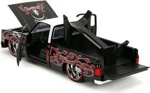 1985 Chevrolet C-10 Pickup Truck Black with White Top and Graphics with Charro Man Diecast Figure "Tapatio" 1/24 Diecast Model Car by Jada