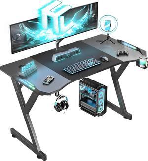 HLDIRECT 55 Inch Gaming Desk with LED Lights, Ergonomic Computer Gaming Table with Carbon Fibre Surface, Sturdy PC Workstation Desk for Gaming and Home Office with Headphone Hook, Cup Holder, Black
