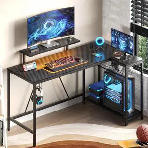 Bestier 58" Ergonomic L Shaped Gaming Desk with Monitor Stand, Power Outlet & USB Ports, Reversible Corner Computer Desk with LED Lights, Headphone Hooks & Storage Shelves, Carbon Fiber Black