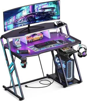 MOTPK Gaming Desk with Power Outlet & LED Lights, Computer Desk 39inch with PC Storage Shelf, Gaming Table with Carbon Fiber Texture, Gamer Desk, Gift for Boys Men, Black