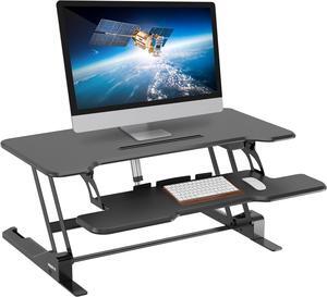 Mount-It! Electric Standing Desk Converter with 38" Tabletop, Height Adjustable Sit Stand Desk Riser, Motorized Desk Riser with Keyboard Tray and Device Slot, Fits Monitor & Laptop, Black