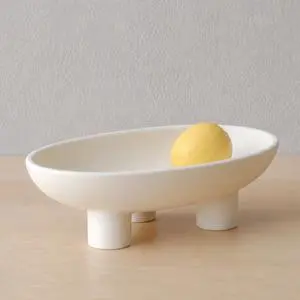 Three-Legs Ceramic Fruit Bowl for Kitchen Counter, Decorative Bowl for Table Décor, 10-inch Oval Large Bowls for Breads (Matte Crème) Three-Legs Ceramic Fruit Bowl for Kitchen Counter, Decorative Bowl for Table Décor, 10-inch Oval Large Bowls for Breads (Matte Crème)