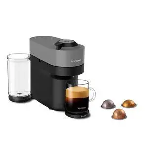 Nespresso Original Vertuo Pop+ Coffee & Espresso Maker by Breville, Grey | Dark grey coffee and espresso machine with compact design, 25 fl. oz. side tank, 30 second heat-up and one touch brewing. Nespresso Original Vertuo Pop+ Coffee & Espresso Maker by Breville, Grey | Dark grey coffee and espresso machine with compact design, 25 fl. oz. side tank, 30 second heat-up and one touch brewing.