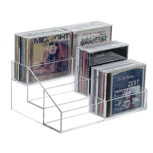 3 Tier CD Storage Rack, Clear Acrylic Disc Holder Holds 36 Cases Three-tier organizer stores up to 36 jewel cases with a clear design for easy viewing and compact media organization 3 Tier CD Storage Rack, Clear Acrylic Disc Holder Holds 36 Cases Three-tier organizer stores up to 36 jewel cases with a clear design for easy viewing and compact media organization