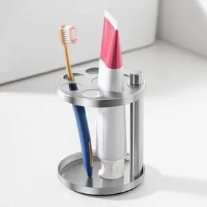 Stainless Toothbrush Holder Stand for Bathroom: Stainless Steel Ventilated Organizer with Slots for Electric Toothbrushes, Toothpaste, Razors & Small Comb, Unique Footprint Base Design, Brushed Silver Stainless Toothbrush Holder Stand for Bathroom: Stainless Steel Ventilated Organizer with Slots for Electric Toothbrushes, Toothpaste, Razors & Small Comb, Unique Footprint Base Design, Brushed Silver