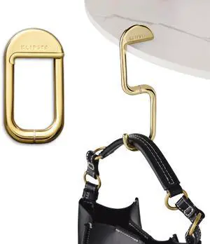 FLIP Bag Hook - Newly Redesigned. Portable Purse Hanger for Table with Magnetic Closure - Now Holds up to 50 lbs (Gold) FLIP Bag Hook - Newly Redesigned. Portable Purse Hanger for Table with Magnetic Closure - Now Holds up to 50 lbs (Gold)