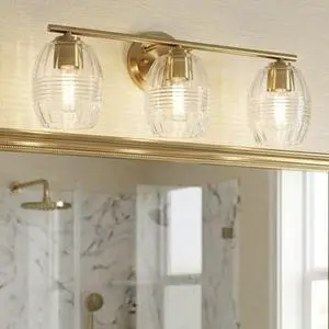 Luster Three Lights Vanity with Clear Glass for Bathrooms Above Mirror Wall Lamp - Satin Brass Luster Three Lights Vanity with Clear Glass for Bathrooms Above Mirror Wall Lamp - Satin Brass