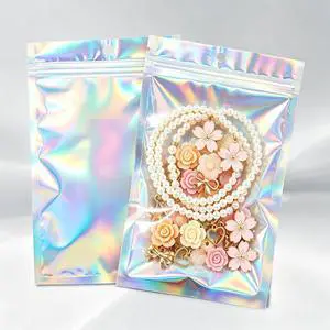 100Pcs Holographic Resealable Mylar Bags, 3x5 In Smell Proof Packaging Bag | Foil Pouch,Resealable Bags for Small Business, Goodie Baggies for Treat, Jewelry, Party Favors, Candy, Christmas Gift Bags 100Pcs Holographic Resealable Mylar Bags, 3x5 In Smell Proof Packaging Bag | Foil Pouch,Resealable Bags for Small Business, Goodie Baggies for Treat, Jewelry, Party Favors, Candy, Christmas Gift Bags