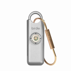 Shes BirdieThe Original Personal Safety Alarm for Women by WomenLoud Siren, Strobe Light and Key Chain in a Variety of Colors (Metallic Silver) Shes BirdieThe Original Personal Safety Alarm for Women by WomenLoud Siren, Strobe Light and Key Chain in a Variety of Colors (Metallic Silver)