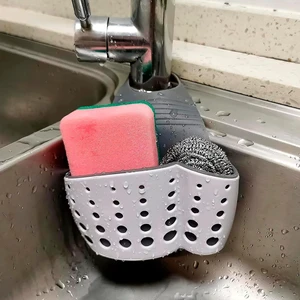 Hanging Sponge Holder for Kitchen Sink, Over Faucet Silicone Caddy | Adjustable Strap Wraps Most Taps While Drain Holes Let Sponges Dry Fast - White Silicone Wipes Clean, No Suction Cups Needed Hanging Sponge Holder for Kitchen Sink, Over Faucet Silicone Caddy | Adjustable Strap Wraps Most Taps While Drain Holes Let Sponges Dry Fast - White Silicone Wipes Clean, No Suction Cups Needed