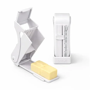 Butter Slicer and Dispenser, Adjustable Cutter for Stick Butter, White | ABS body with stainless steel wire; measuring marks; storage case use; includes replacement scale strip. Butter Slicer and Dispenser, Adjustable Cutter for Stick Butter, White | ABS body with stainless steel wire; measuring marks; storage case use; includes replacement scale strip.