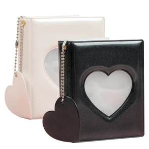 2-Pack Mini Photocard Binders with Heart Windows, Black and White | Heart-window covers keep mini prints together while the black-and-white pair separates people, trips or themes at a glance 2-Pack Mini Photocard Binders with Heart Windows, Black and White | Heart-window covers keep mini prints together while the black-and-white pair separates people, trips or themes at a glance