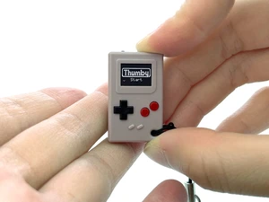 Thumby Programmable Game Console Keychain Retro Gaming Fun Mini-Console, STEM Learning, USB Rechargeable, 5 Preloaded Games (Gray) Thumby Programmable Game Console Keychain Retro Gaming Fun Mini-Console, STEM Learning, USB Rechargeable, 5 Preloaded Games (Gray)