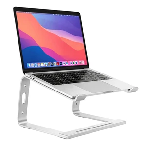 Staples TECH Adjustable Aluminum Laptop Stand, 11-17 In, Silver | Ergonomic eye-level riser with ventilated cooling and anti-slip base. Staples TECH Adjustable Aluminum Laptop Stand, 11-17 In, Silver | Ergonomic eye-level riser with ventilated cooling and anti-slip base.