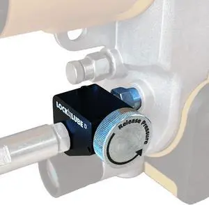 Pressure Return Valve for Use with Cordless Grease Guns. No More Pressure Locks! Returns Grease to The Tube. Releases Hose backpressure. Pressure Return Valve for Use with Cordless Grease Guns. No More Pressure Locks! Returns Grease to The Tube. Releases Hose backpressure.