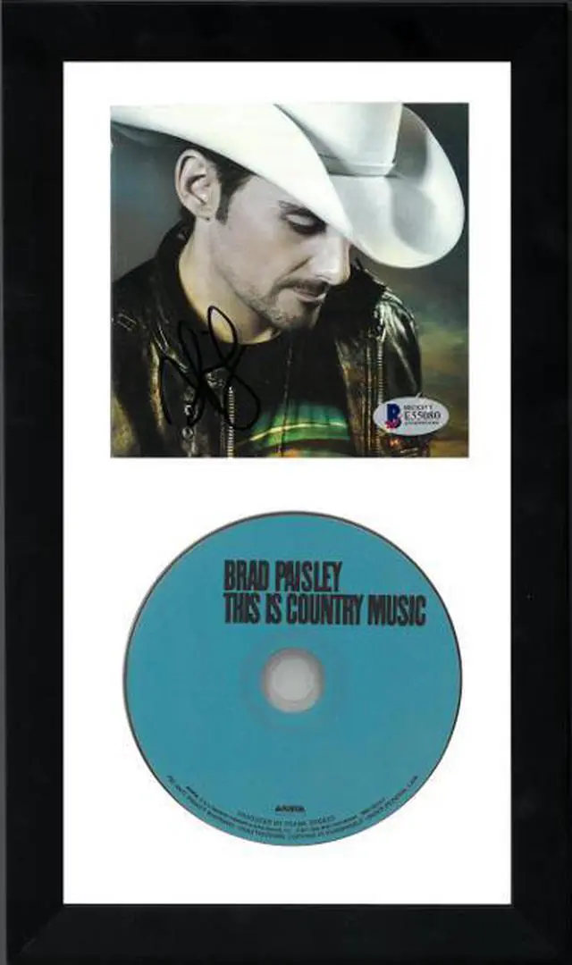 Main image of Brad Paisley signed This is Country Music Album Cover w/ CD 6.5x12 Custom Framing- Beckett/BAS #E55080
