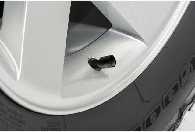Alt view image 2 of 4 - Chevrolet Corvette C7 Logo in White on Black Aluminum Cylinder-Style Tire Valve Stem Caps