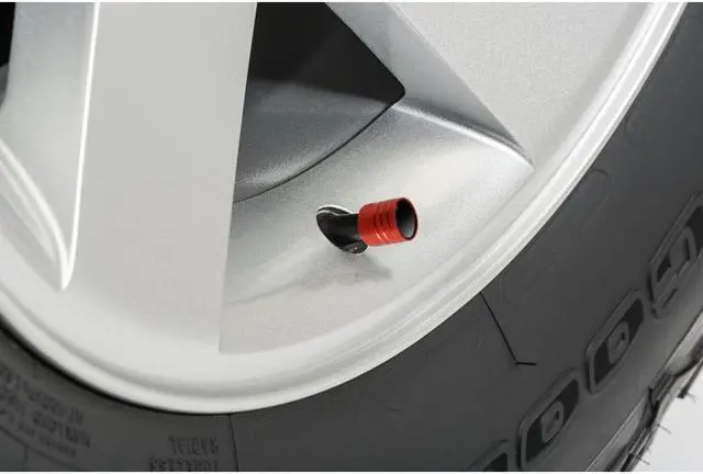 Alt view image 2 of 4 - GMC Logo in White on Red Aluminum Cylinder-Style Tire Valve Stem Caps