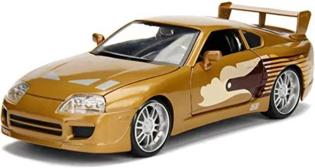 Main image of Slap Jack\'s Toyota Supra Gold \Fast & Furious\" Movie 1/24 Diecast Model Car by Jada"