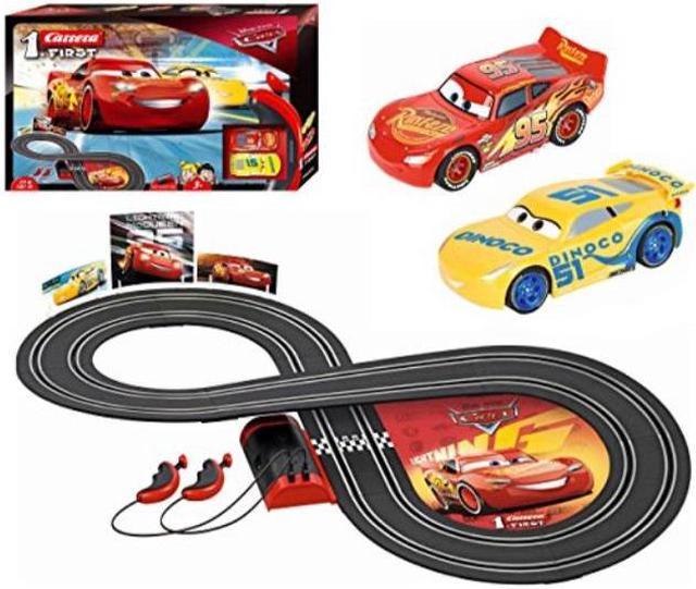 carrera first disney/pixar cars 3 slot car race track includes 2 cars:  lightning mcqueen and dinoco cruz batterypowered beginner racing set for  kids ages 3 years and up 