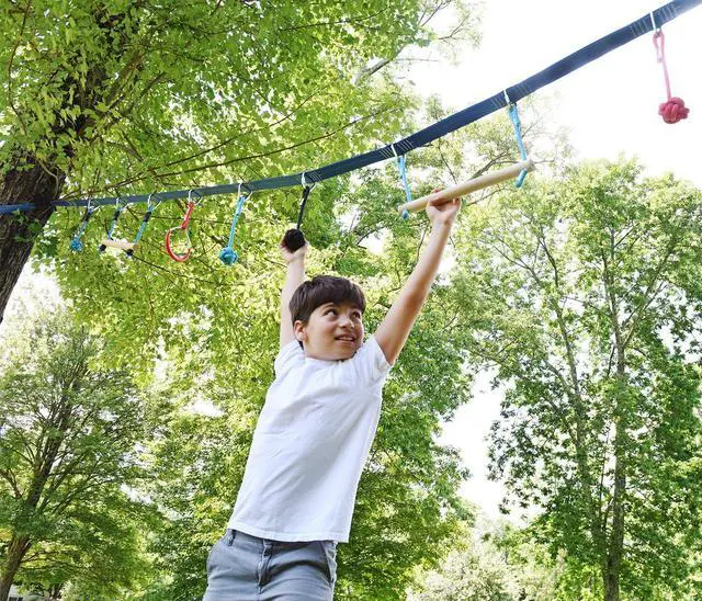 Alt view image 7 of 7 - Portable 50 Foot Slackline Monkey Bar and Ladder Kit - Kids Swinging Obstacle Course Set - Bars, Fists, Gymnastics Rings - 250lb Capacity - Storage Bag & Tree Protectors Included
