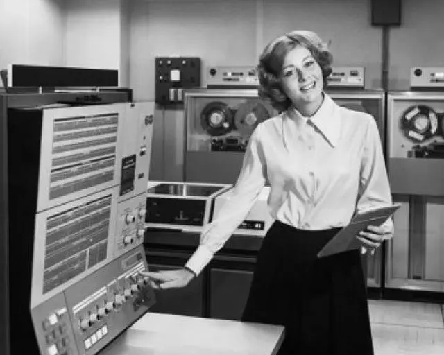 Main image of Portrait of a businesswoman operating a computer Poster Print (24 x 36)
