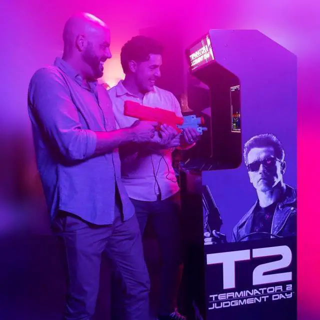 Alt view image 3 of 7 - Arcade1Up Terminator 2 Deluxe Arcade Machine - 17" Color Screen - Real-Feel Arcade Light Guns - Wi-Fi Leaderboards - 1 Classic Game & Behind the scenes footage - Perfect for at-Home Gaming