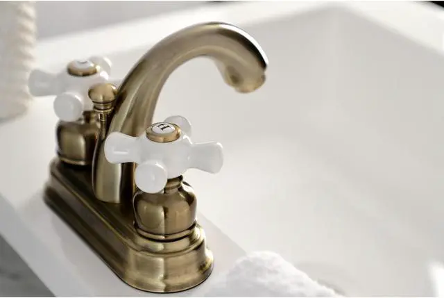 Alt view image 10 of 11 - Kingston Brass KB5613PX Restoration 4 in. Centerset Bathroom Faucet, Antique Brass