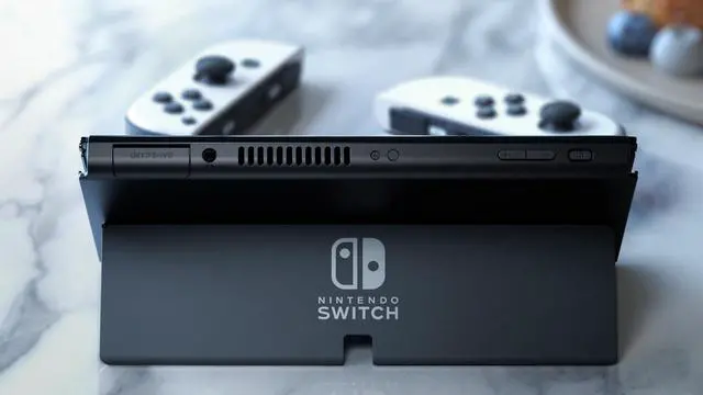 Alt view image 7 of 7 - 2021 New Nintendo Switch OLED Model White Joy Con 64GB Console Improved HD Screen & LAN-Port Dock with Pokemon Shield And Mytrix Accessories