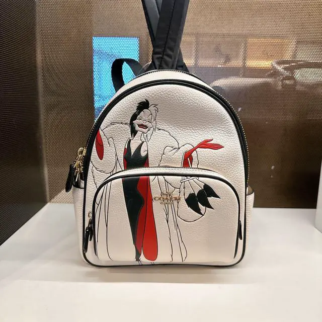 coach disney mini backpack Parks Loungefly Purple Inside Out 2 "Core Memorie I Love Characters Refined pebble leather Inside multifunction pocket Zip closure fabric lining Top handle with 2 1/2 drop Outside zip pocket Adjustable shoulder strap for crossbody wear 6 (L) x 8 (H) x 3 (W) Mickey Mouse character Coach Mini Charle Backpack With
